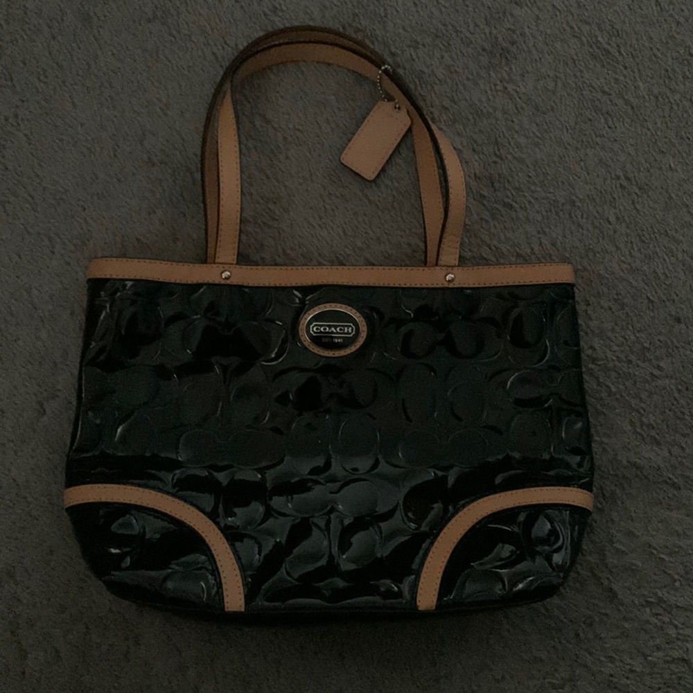 Small Coach patent leather handbag.